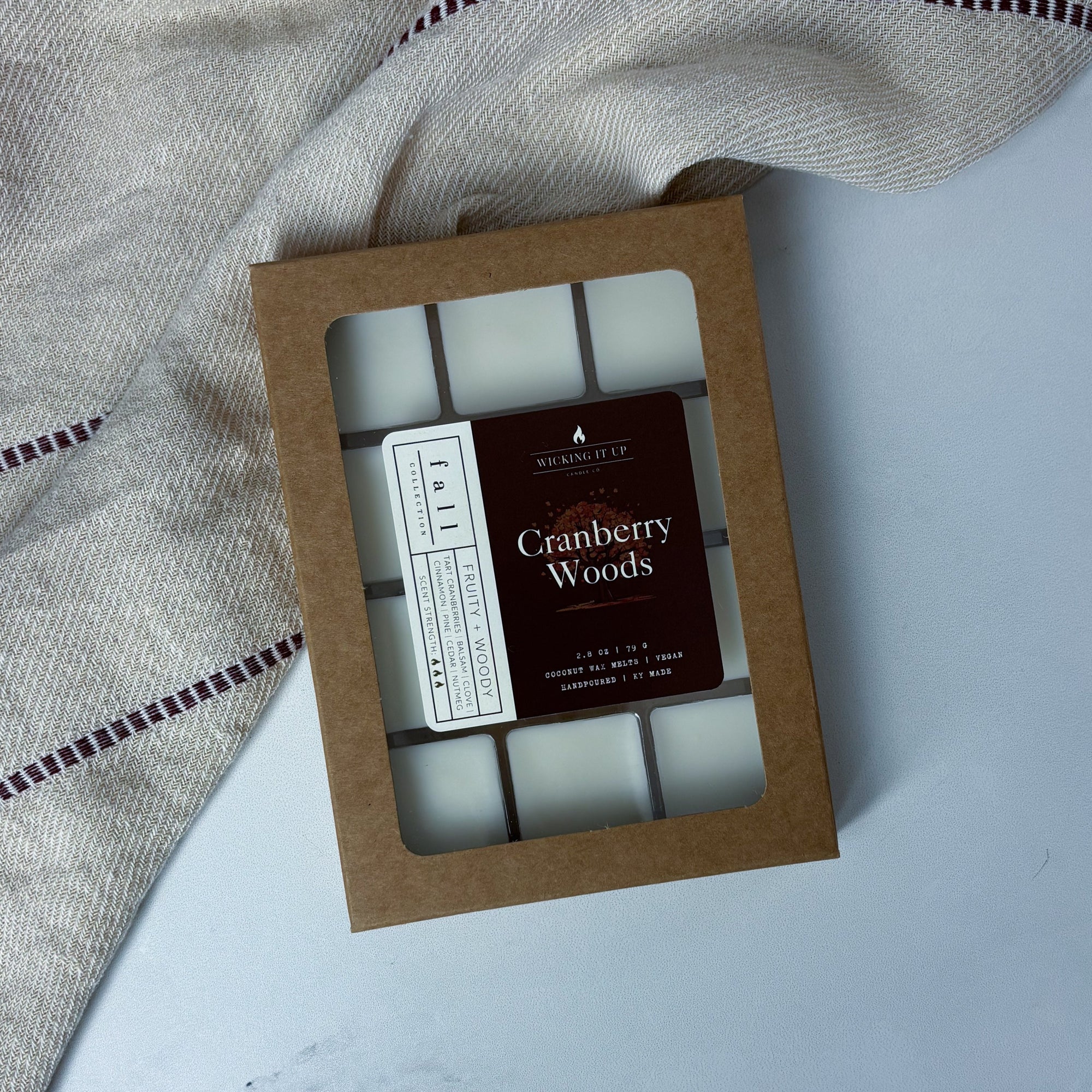 Box of wax melts labeled 'Cranberry Woods' on a light background