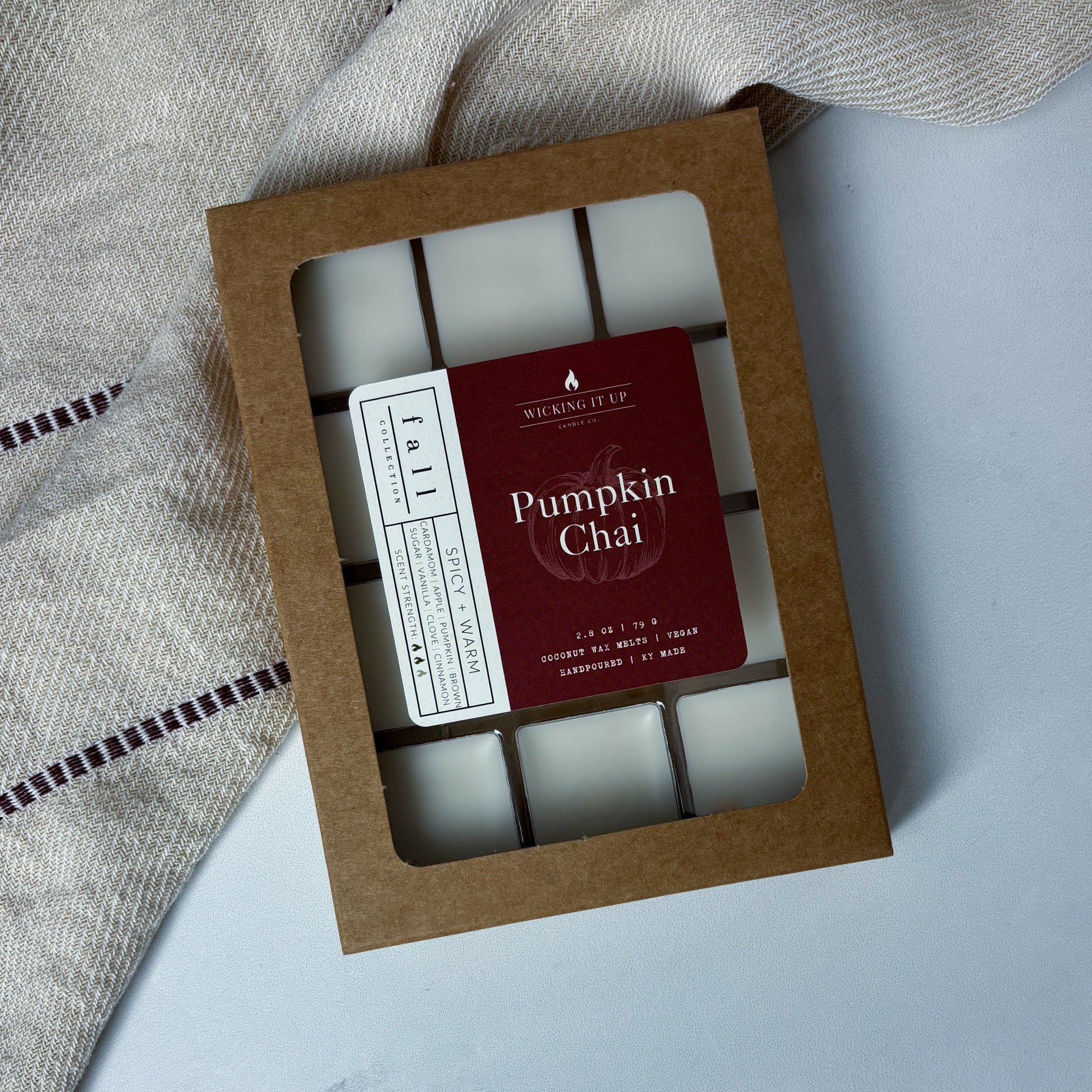 Box of pumpkin chai wax melts with a visible brand label on a light background